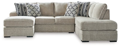 Ashley Furniture Calnita sectional with chaise showing plush fabric, modern design, and spacious seating arrangement.