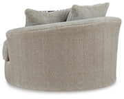 Ashley Furniture Calnita oversized swivel accent chair with plush upholstery and a contemporary design, shown from the back.