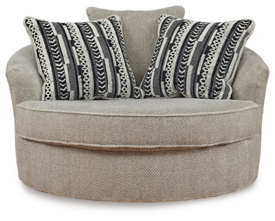 Ashley Furniture Calnita oversized swivel accent chair with plush upholstery and rounded design, viewed from front angle.