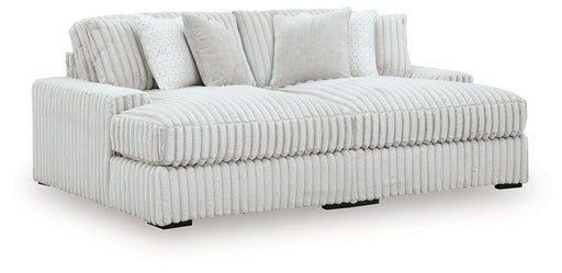 Ashley Furniture Stupendous Super Chaise sectional with plush cushions and modern design, viewed from an angled perspective.