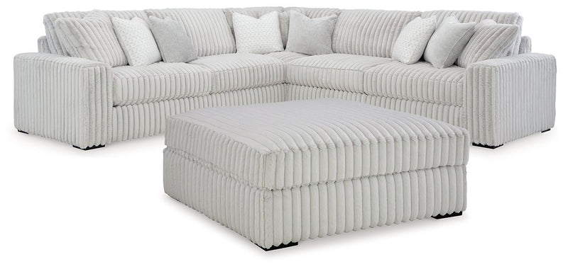 Ashley Furniture Stupendous living room set with plush sofa and matching chairs, arranged in a modern, stylish living space.