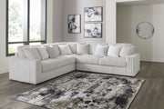 Ashley Furniture living room set featuring a sectional sofa, armchair, and matching coffee table in a modern design.