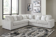 Ashley Furniture living room set with plush sofa and matching armchair, featuring neutral fabric and modern design.