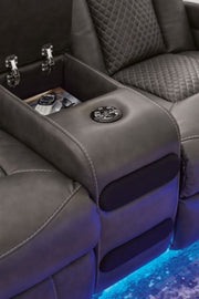 Ashley Furniture Fyne-Dyme Power Reclining Loveseat with Console, featuring plush upholstery and built-in cup holders.