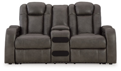 Ashley Furniture Fyne-Dyme Power Reclining Loveseat with Console, shown head-on in a sleek, modern living room setting