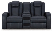 Ashley Furniture Fyne-Dyme power reclining loveseat with built-in console, shown in a head-on view with plush cushions and modern design.