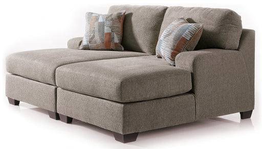 Ashley Furniture Newellen Super Chaise sectional with plush upholstery and modern design, featuring a spacious chaise lounge.