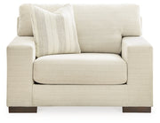 Ashley Furniture Maggie oversized chair with plush fabric, wide seating, and supportive armrests, shown from a front head-on view.