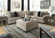 Ashley Furniture Bovarian Sectional sofa with plush cushions and neutral fabric, shown with multiple seating sections and armrests.
