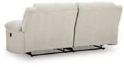 Ashley Furniture Orlen reclining sofa with plush cushions and a dark fabric finish, shown from the back view.