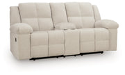 Ashley Furniture Orlen reclining loveseat with console, featuring plush upholstery and built-in cup holders, shown from an angled view.