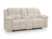 Ashley Furniture Orlen reclining loveseat with built-in console, featuring plush cushions and dark upholstery from a side angle.