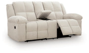 Ashley Furniture Orlen reclining loveseat with console, shown from an open angle, featuring plush upholstery and built-in cup holders.