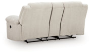 Ashley Furniture Orlen reclining loveseat with console, featuring plush fabric, padded armrests, and a built-in storage console.