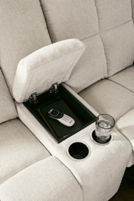 Ashley Furniture Orlen reclining loveseat with built-in console, gray fabric, plush cushions, and armrests for comfortable seating.