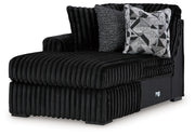 Ashley Furniture Midnight-Madness sectional with chaise, showing plush fabric, modern design, and spacious seating from an angled view.
