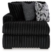 Ashley Furniture Midnight-Madness sectional with chaise, showing plush gray fabric, modern design, and spacious seating arrangement.