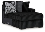 Ashley Furniture Midnight-Madness sectional with chaise, featuring dark upholstery and modern design, shown from an angled view.