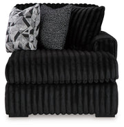 Ashley Furniture Midnight-Madness sectional with chaise, featuring plush upholstery and modern design, shown from a head-on view.