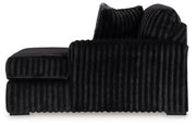 Ashley Furniture Midnight-Madness sectional with chaise, featuring plush cushions and dark upholstery for modern living room comfort.
