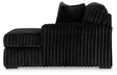 Ashley Furniture Midnight-Madness sectional with chaise, featuring plush cushions and dark upholstery for modern living room comfort.