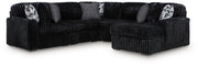 Ashley Furniture Midnight-Madness sectional with chaise, featuring plush fabric and modern design in a stylish living room setting.