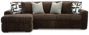 Ashley Furniture Midnight-Madness sectional sofa with chaise, showing plush cushions and dark upholstery in a modern living room setting.