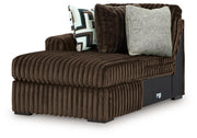 Ashley Furniture Midnight-Madness sectional with chaise, showing a stylish dark fabric sofa with a chaise lounge in a modern living room setting.