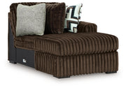 Ashley Furniture Midnight-Madness sectional with chaise, featuring plush fabric and modern design, shown from an angled side view.