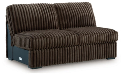 Ashley Furniture Midnight-Madness sectional with chaise, featuring plush fabric and modern design, shown from an angled view.