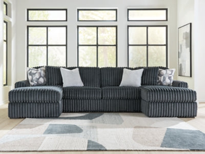 Ashley Furniture Midnight-Madness sectional with chaise, plush upholstery and modern design, shown in a stylish living room setting.