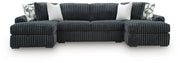 Ashley Furniture Midnight-Madness sectional with chaise, featuring plush cushions and modern design in a cozy living room setting.