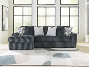 Ashley Furniture Midnight-Madness sectional sofa with chaise, featuring plush cushions and a modern design, shown in the cropped image.