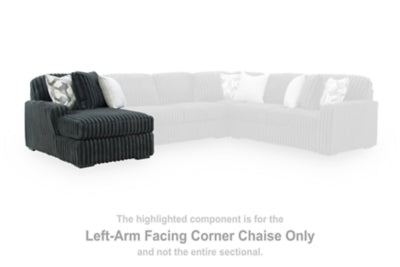Ashley Furniture Midnight-Madness Super Chaise sectional in dark fabric, featuring plush cushions and modern design.