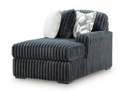 Ashley Furniture Midnight-Madness sectional sofa with chaise, featuring plush cushions and modern design, shown from an angled view.