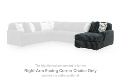 Midnight-Madness Ashley Furniture sectional chaise with plush cushions and dark fabric upholstery, modern and comfortable living room furniture