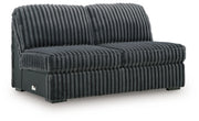 Ashley Furniture Midnight-Madness sectional with chaise, featuring plush upholstery and modern design, shown from an angled view.