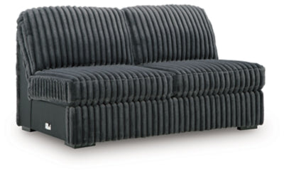 Ashley Furniture Midnight-Madness sectional with chaise, featuring plush upholstery and modern design, shown from an angled view.