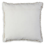 Ashley Furniture Aavie Pillow showing a soft, plush pillow with a textured design in neutral tones.