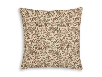 Set of four Ashley Furniture Altmontner pillows with soft fabric covers and decorative designs, ideal for enhancing sofa or bed decor.