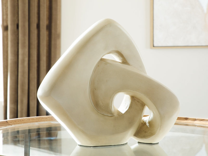 Ashley Furniture Feebs sculpture, modern abstract art piece with textured finish, displayed on a neutral background.