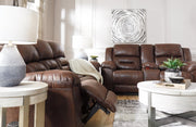 Ashley Furniture Stoneland reclining loveseat with built-in console, featuring plush cushions and dark upholstery for comfortable seating.