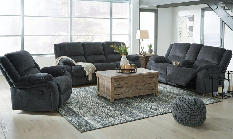 Ashley Furniture Draycoll living room set featuring a sofa and armchair with neutral upholstery and contemporary design.
