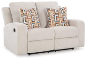 Ashley Furniture Danum Reclining Loveseat with plush fabric and padded armrests, designed for comfort and relaxation.