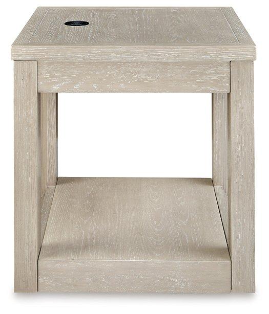 Ashley Furniture Marxhart End Table with wooden top and metal legs, modern design for living room decor.
