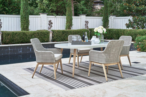Seton Creek outdoor dining set by Ashley Furniture with a table and chairs, ideal for outdoor patio dining.