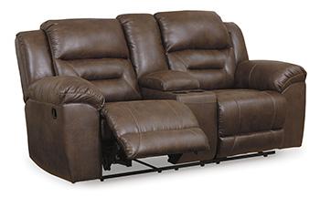Ashley Furniture Stoneland reclining loveseat with built-in console, shown in a cozy living room setting with plush upholstery.