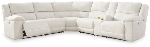 Ashley Furniture Keensburg Power Reclining Sectional with plush fabric and multiple reclining seats in a modern living room setting.