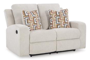 Ashley Furniture Danum reclining loveseat with plush cushions and wide armrests, perfect for relaxing in the living room.
