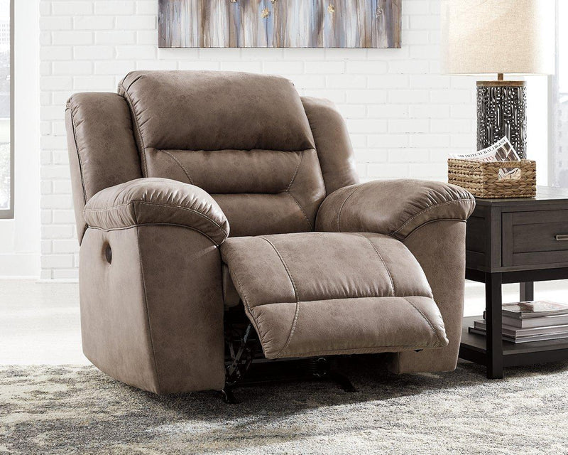 Ashley Furniture Stoneland power recliner with plush cushioning and armrests, perfect for relaxing in style.
